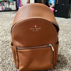 Brown Kate spade backpack.  Used once.